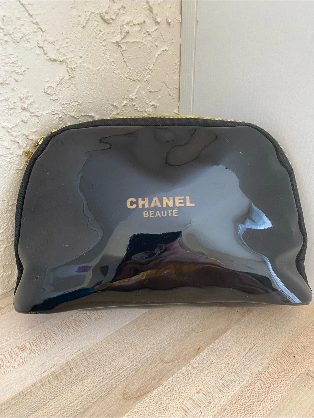 CHANEL Black Patent Cosmetic Pouch with Gold Zip Accents